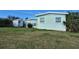 Large backyard with a shed and green lawn at 2232 Gifford St, Port Charlotte, FL 33952