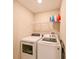 Laundry room with washer, dryer, and shelving at 11855 Dumaine Valley Rd, Riverview, FL 33579