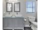 Bathroom with double sinks and gray vanity at 25393 Durango Ct, Punta Gorda, FL 33955
