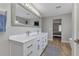 Modern bathroom with double vanity, large mirror, and updated fixtures at 25393 Durango Ct, Punta Gorda, FL 33955
