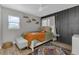Cozy bedroom with a queen-size bed and accent wall at 25393 Durango Ct, Punta Gorda, FL 33955