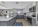 Updated kitchen with gray cabinets, white countertops, and stainless steel appliances at 25393 Durango Ct, Punta Gorda, FL 33955