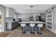 Modern kitchen with gray and white cabinets, quartz countertops, and an island at 25393 Durango Ct, Punta Gorda, FL 33955