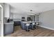 Modern kitchen with gray and white cabinets, quartz countertops, and island at 25393 Durango Ct, Punta Gorda, FL 33955
