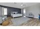 Spacious main bedroom with king-size bed and geometric wall at 25393 Durango Ct, Punta Gorda, FL 33955