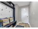 Inviting mudroom with built-in bench, hooks, and shelving at 25393 Durango Ct, Punta Gorda, FL 33955