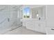 Bathroom with walk-in shower, soaking tub, and modern vanity at 13438 Mcintosh Ave, Port Charlotte, FL 33981