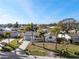 Aerial view of a charming home with a well-kept lawn and palm trees in a waterfront neighborhood at 105 12Th Sw St, Ruskin, FL 33570