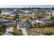 Aerial shot of a cute waterfront home with a garage and palm trees in a vibrant community with waterways and canals at 105 12Th Sw St, Ruskin, FL 33570