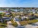Aerial view of a waterfront community featuring well-maintained homes, canals, docks, and lush landscaping on a sunny day at 105 12Th Sw St, Ruskin, FL 33570