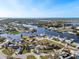 Scenic aerial view of a waterfront community with multiple canals and beautiful houses at 105 12Th Sw St, Ruskin, FL 33570