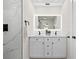 Bright bathroom featuring a double sink vanity with marble countertop and black hardware at 105 12Th Sw St, Ruskin, FL 33570