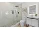 Modern bathroom featuring a glass shower with marble walls and a modern sink at 105 12Th Sw St, Ruskin, FL 33570