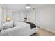 Bright bedroom with a comfortable bed, large window, and closet space at 105 12Th Sw St, Ruskin, FL 33570