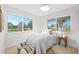 Bright bedroom with large windows, cozy decor, and plenty of natural light at 105 12Th Sw St, Ruskin, FL 33570