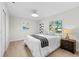Cozy bedroom with lots of natural light, a comfortable bed, and modern decorations at 105 12Th Sw St, Ruskin, FL 33570