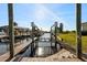 Waterfront property featuring a private boat dock for easy water access and scenic views at 105 12Th Sw St, Ruskin, FL 33570