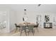 Dining room with modern chandelier, stylish chairs, and an inviting atmosphere at 105 12Th Sw St, Ruskin, FL 33570