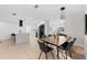 Open concept dining area with modern lighting seamlessly connects to the kitchen at 105 12Th Sw St, Ruskin, FL 33570