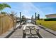 Dock area featuring boat lifts and a wooden dock with a picnic table and clear blue skies at 105 12Th Sw St, Ruskin, FL 33570