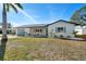Charming single-story home featuring a well-maintained lawn and a light blue garage door at 105 12Th Sw St, Ruskin, FL 33570