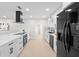 Spacious kitchen with stainless steel appliances, modern cabinets, and open layout at 105 12Th Sw St, Ruskin, FL 33570