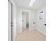 Well-lit laundry room with skylight, ample space, and modern white walls and flooring at 105 12Th Sw St, Ruskin, FL 33570