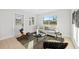 Comfortable living room with stylish furniture, modern decor, and natural light with a view of the front yard at 105 12Th Sw St, Ruskin, FL 33570