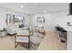 Bright living room featuring modern furniture, light wood floors, and a large window at 105 12Th Sw St, Ruskin, FL 33570