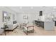 Open concept living area with modern furniture, bright lighting, and stylish accents at 105 12Th Sw St, Ruskin, FL 33570