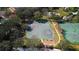 Aerial view of a basketball court, tennis courts, and landscaping in a community at 12417 Adventure Dr, Riverview, FL 33579