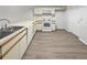 Functional kitchen with white cabinetry, laminate countertops, and modern appliances at 18315 Aintree Ct, Tampa, FL 33647