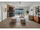 Inviting living room boasts a stone fireplace, neutral color palette, and sliding doors to the screened in lanai at 18315 Aintree Ct, Tampa, FL 33647