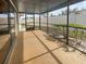 Enclosed patio with a textured floor and screened walls at 18315 Aintree Ct, Tampa, FL 33647