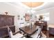 A formal dining room including a chandelier, wood table, and seating for eight at 3107 Pine St, Bradenton, FL 34208