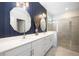 Stylish bathroom features an extended vanity with dual sinks and a glass-enclosed shower at 11400 Burgundy Dr, Venice, FL 34293