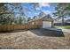 Large backyard with a privacy fence and a large space for activities and entertaining at 12175 Phoenix Ave, Weeki Wachee, FL 34614