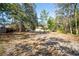 Backyard with trees, a shed, partial fencing and ample space to roam at 12175 Phoenix Ave, Weeki Wachee, FL 34614