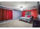 Bedroom featuring neutral carpeting, a ceiling fan, and comfortable furnishings at 12175 Phoenix Ave, Weeki Wachee, FL 34614