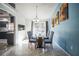 Dining room showcasing natural light, backyard views, and seamless access to the kitchen at 12175 Phoenix Ave, Weeki Wachee, FL 34614