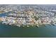 Aerial view of waterfront homes with private docks and boat lifts, showcasing the community's layout at 6354 Cocoa Ln, Apollo Beach, FL 33572