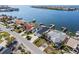 Aerial view of a waterfront property with lush landscaping and a private boat dock at 6354 Cocoa Ln, Apollo Beach, FL 33572