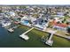 Aerial view of a waterfront home with a swimming pool and dock on a sunny day at 6354 Cocoa Ln, Apollo Beach, FL 33572