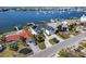 Aerial view of waterfront property with lush landscaping and private boat dock at 6354 Cocoa Ln, Apollo Beach, FL 33572