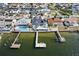 Aerial view of waterfront homes, docks, and swimming pools in a residential neighborhood at 6354 Cocoa Ln, Apollo Beach, FL 33572