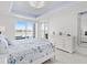 Bedroom featuring a coastal theme, water view, decorative ceiling light and sliding glass doors to the exterior at 6354 Cocoa Ln, Apollo Beach, FL 33572