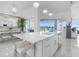 Modern kitchen with a large island, stainless steel appliances, and marble floors at 6354 Cocoa Ln, Apollo Beach, FL 33572