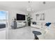 Bright living room featuring a white sectional sofa and a water view at 6354 Cocoa Ln, Apollo Beach, FL 33572