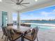 Inviting outdoor dining area with stunning waterfront views, perfect for entertaining and enjoying the scenery at 6354 Cocoa Ln, Apollo Beach, FL 33572