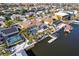 Gorgeous aerial perspective of waterfront homes each featuring private pools, boat docks, and lush landscaping at 818 Golf Island Dr, Apollo Beach, FL 33572